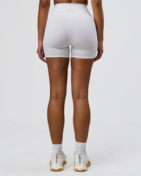 Woman wearing Fusion V-Contour Ultra High-Rise 4" Short Pockets - White | Model:Jordan | Size:S | Thumbnail Index: 4