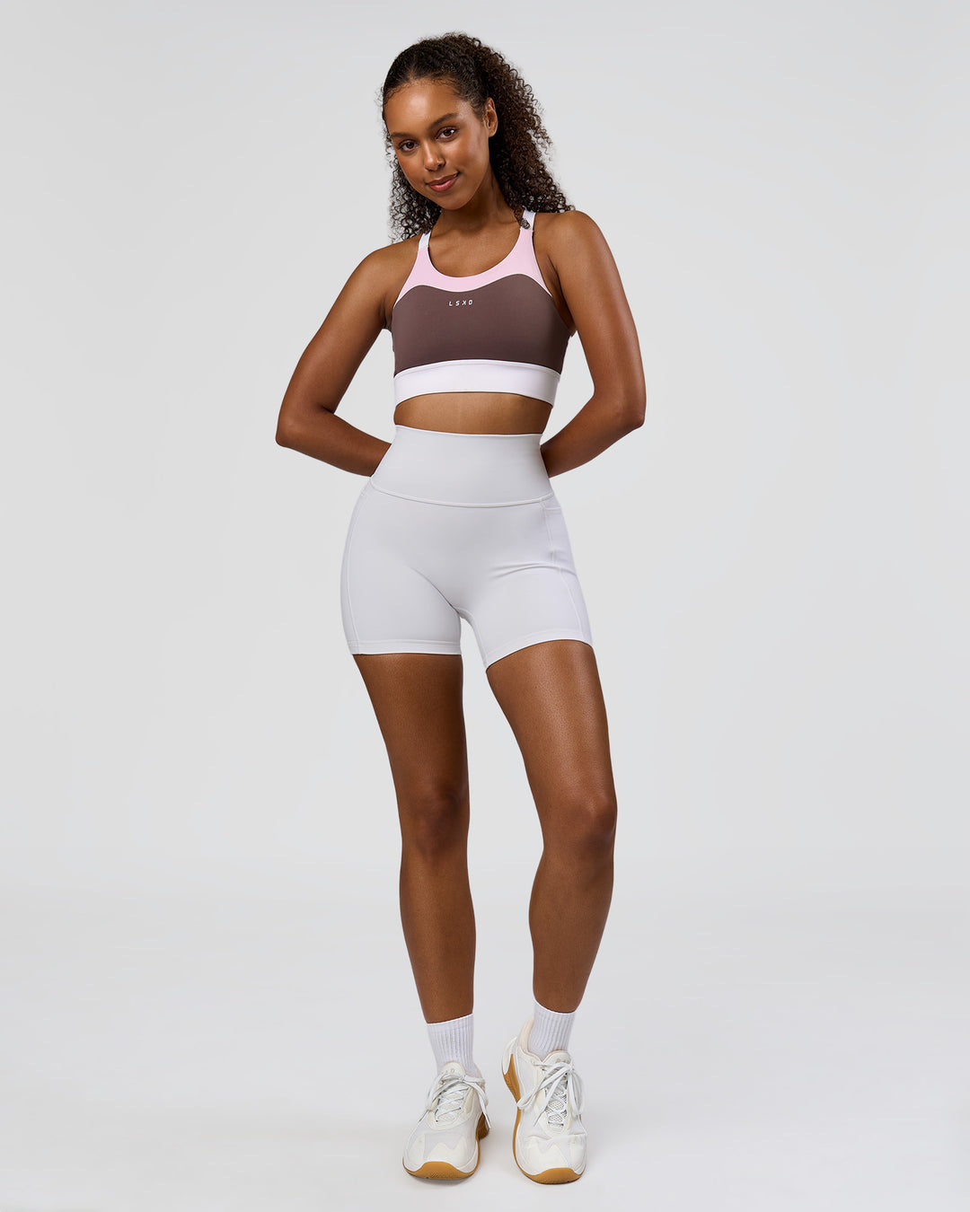 Woman wearing Fusion V-Contour Ultra High-Rise 4" Short Pockets - White | Model:Jordan | Size:S - view 8