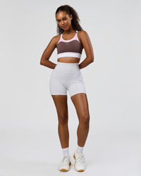 Woman wearing Fusion V-Contour Ultra High-Rise 4" Short Pockets - White | Model:Jordan | Size:S | Thumbnail Index: 7
