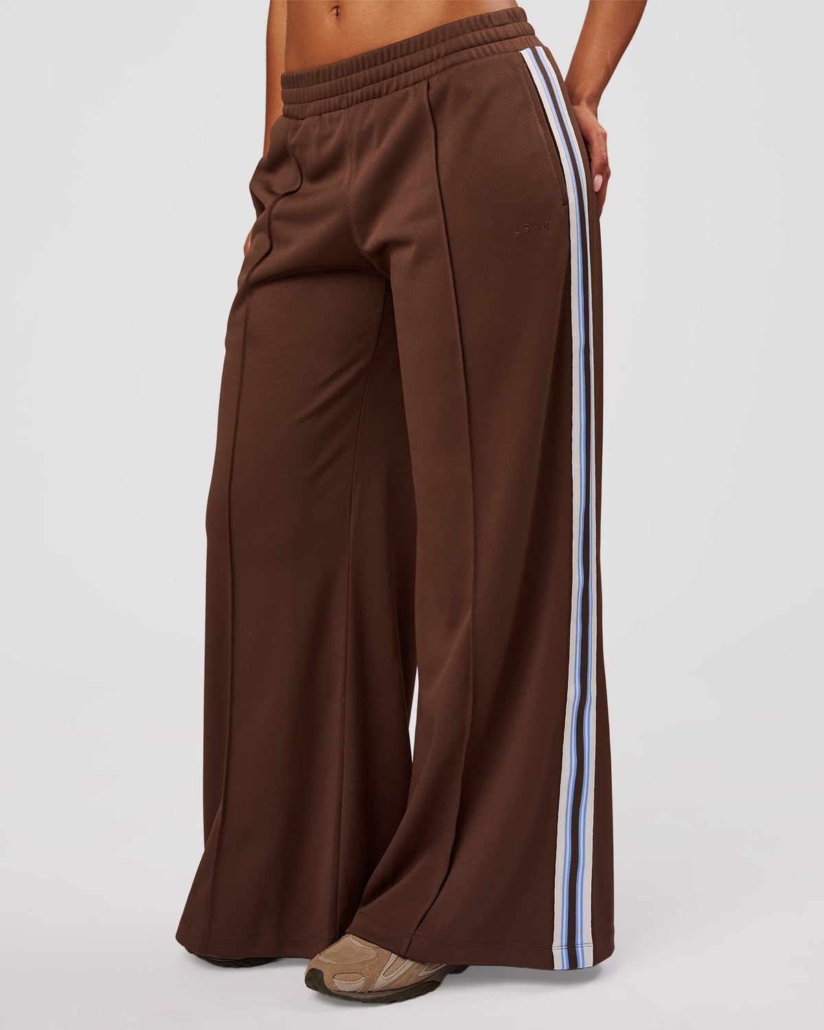 Woman wearing Urban Wide Leg Track Pant - Hot Chocolate-Open Air | Model:Jordan | Size:S