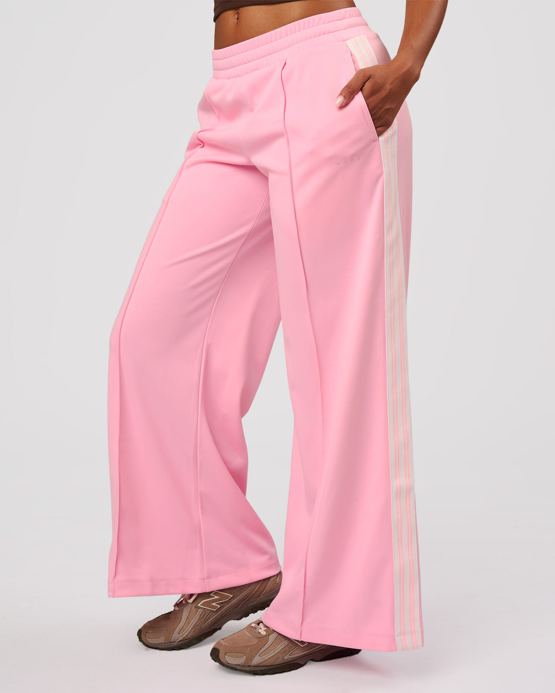 Woman wearing Urban Wide Leg Track Pant - Pink Rose | Model:Jordan | Size:S - view 1