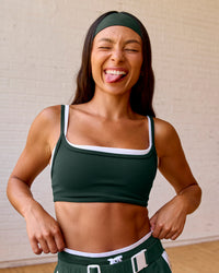 Woman wearing Balance Sports Bra - Midnight Green-White | Model:Meg | Size:S | Thumbnail Index: 2