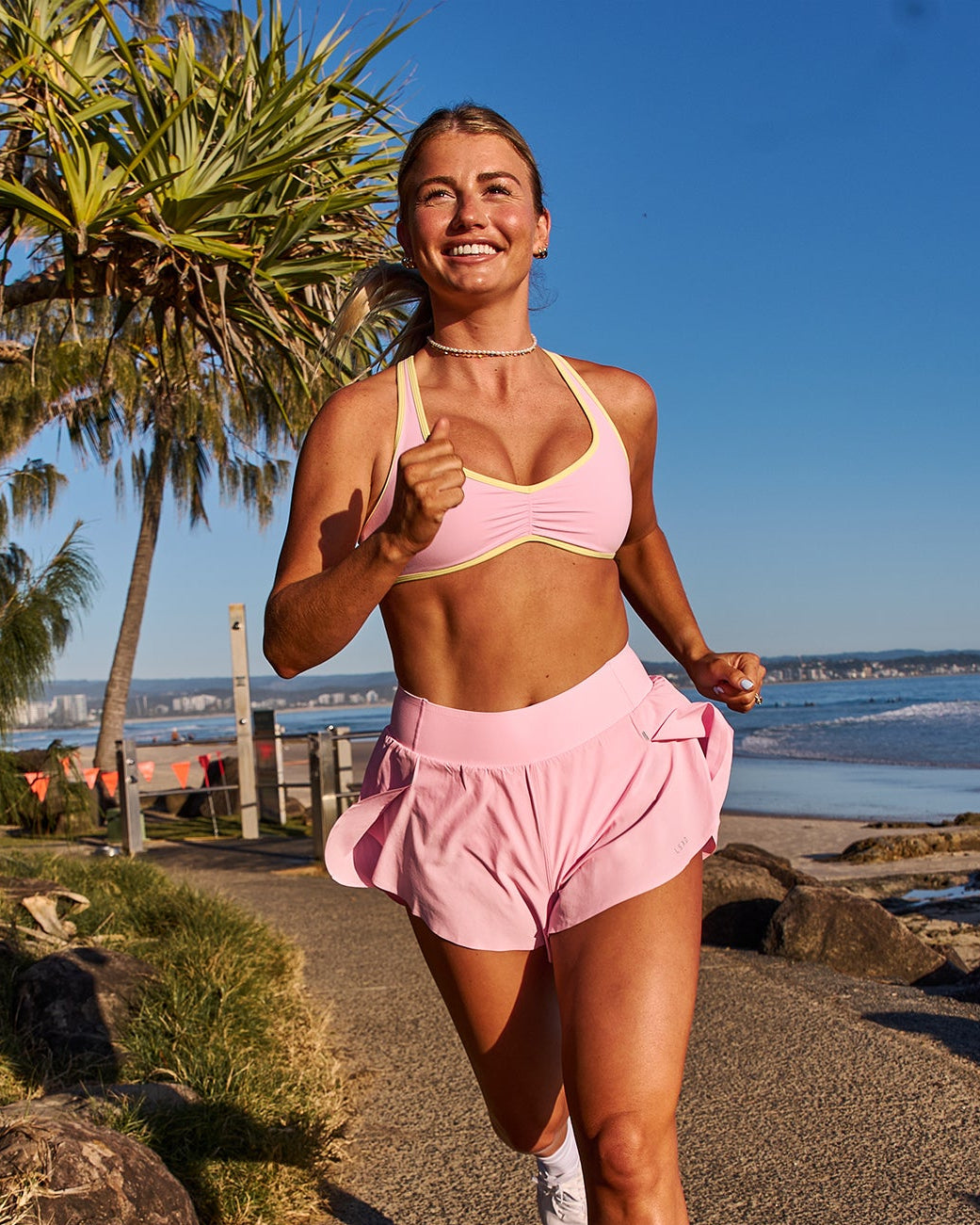 Woman wearing Luminous Sports Bra - Pink Rose-Lemon | Model:Millie | Size:S - view 3