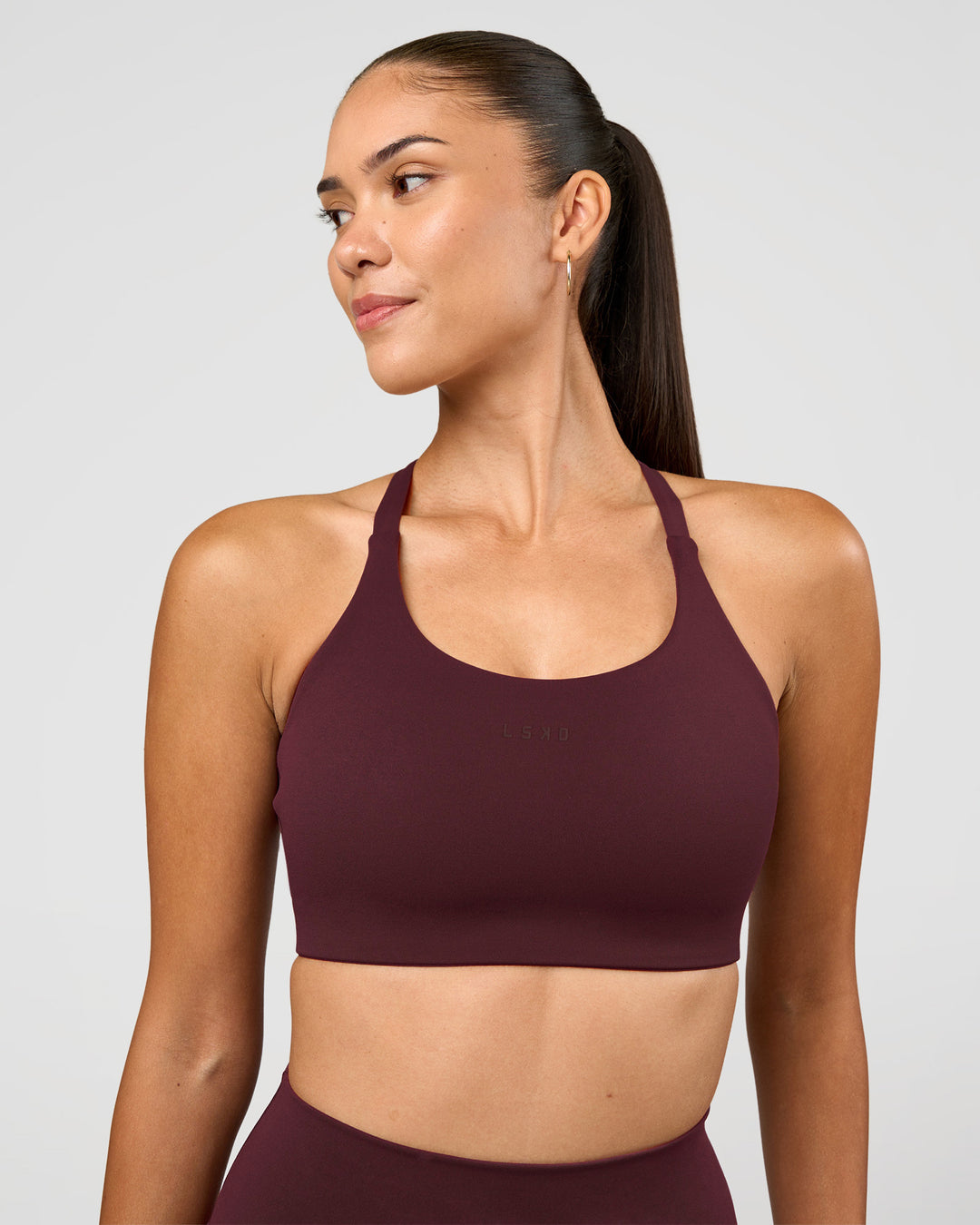 Woman wearing Twist Sports Bra D/DD/E - Cherry Lacquer | Model:Rhiley | Size:S - view 3