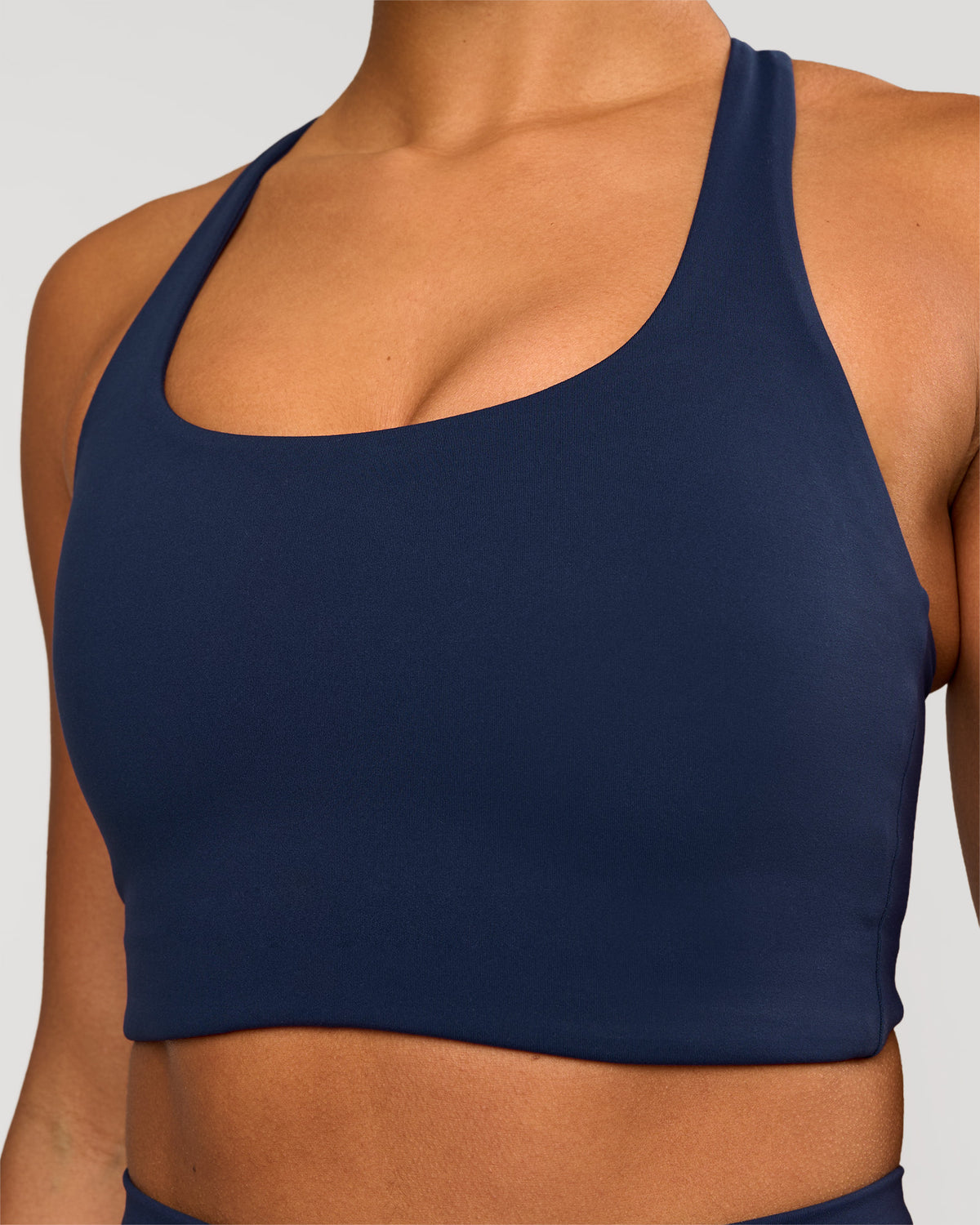 Woman wearing Flow Long Line Sports Bra - Future Navy | Model:Rosie | Size:S