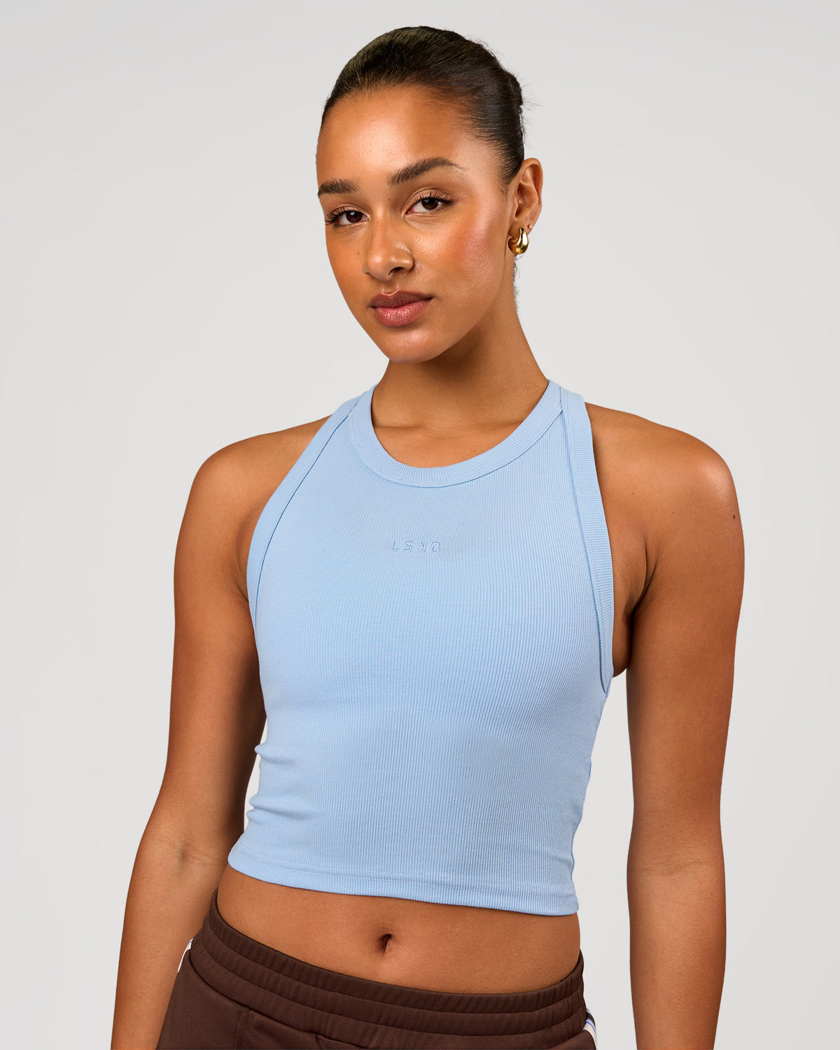 Woman wearing Go-To FLXCotton Rib Crop Tank - Open Air | Model:Rosie | Size:S