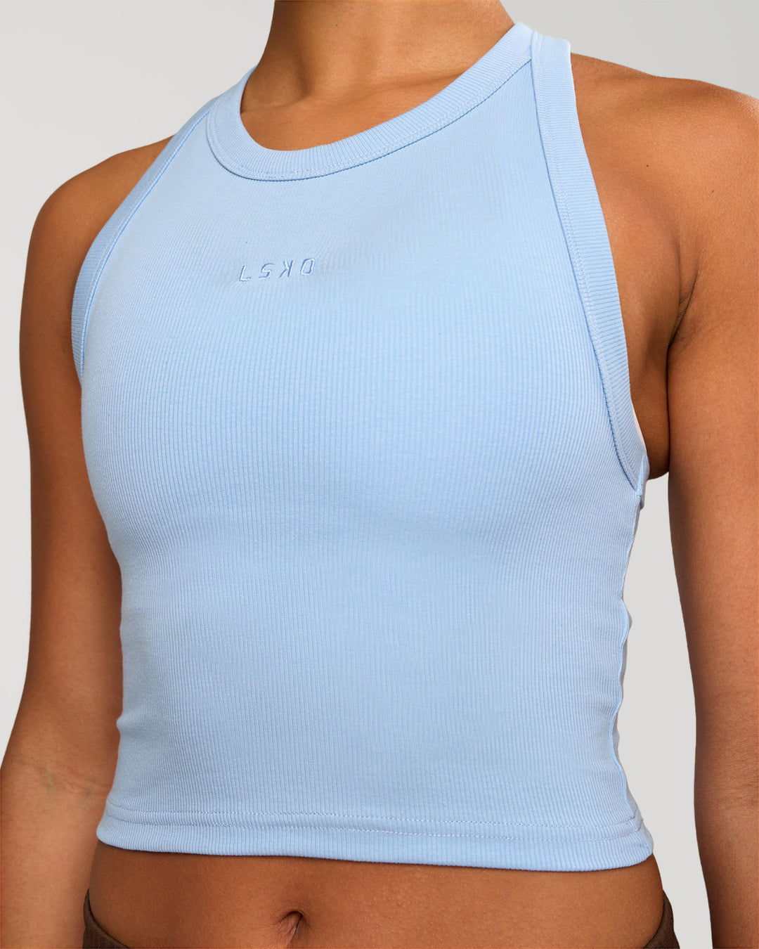 Woman wearing Go-To FLXCotton Rib Crop Tank - Open Air | Model:Rosie | Size:S - view 2