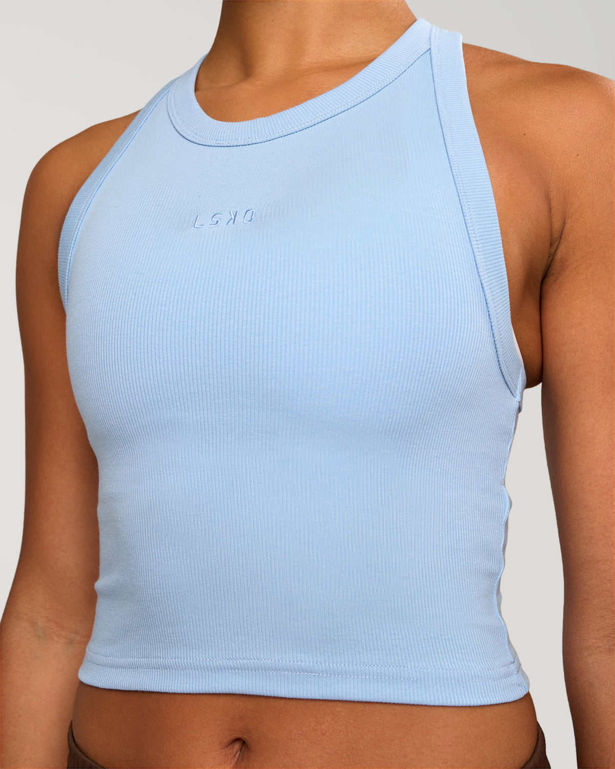 Woman wearing Go-To FLXCotton Rib Crop Tank - Open Air | Model:Rosie | Size:S
