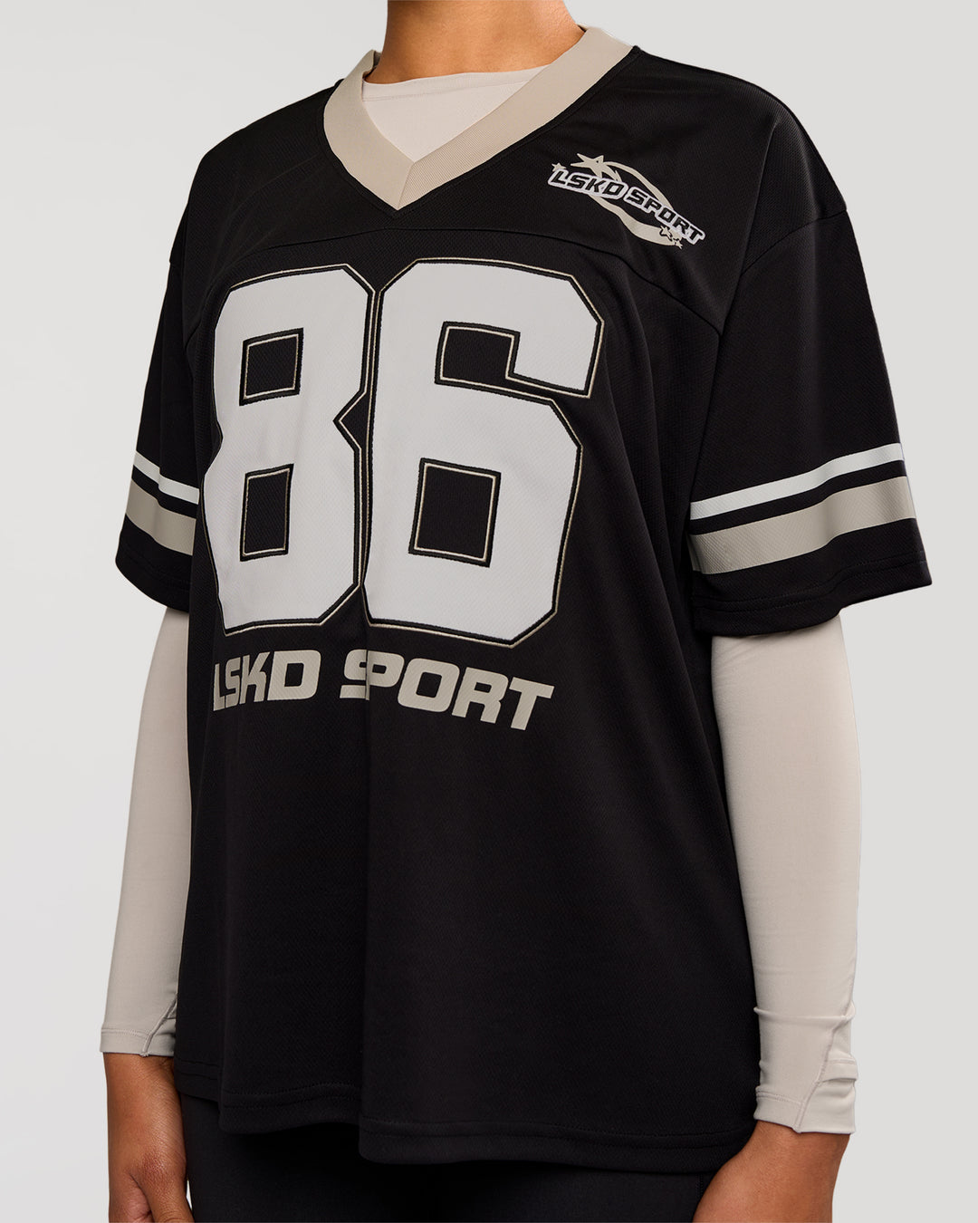 Woman wearing Playmaker V-Neck Jersey - Black-Shale Beige | Model:Rosie | Size:S - view 2