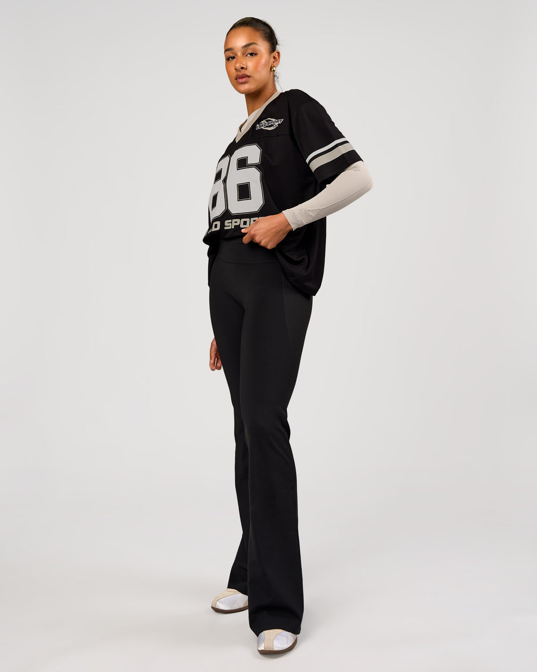 Woman wearing Playmaker V-Neck Jersey - Black-Shale Beige | Model:Rosie | Size:S - view 5