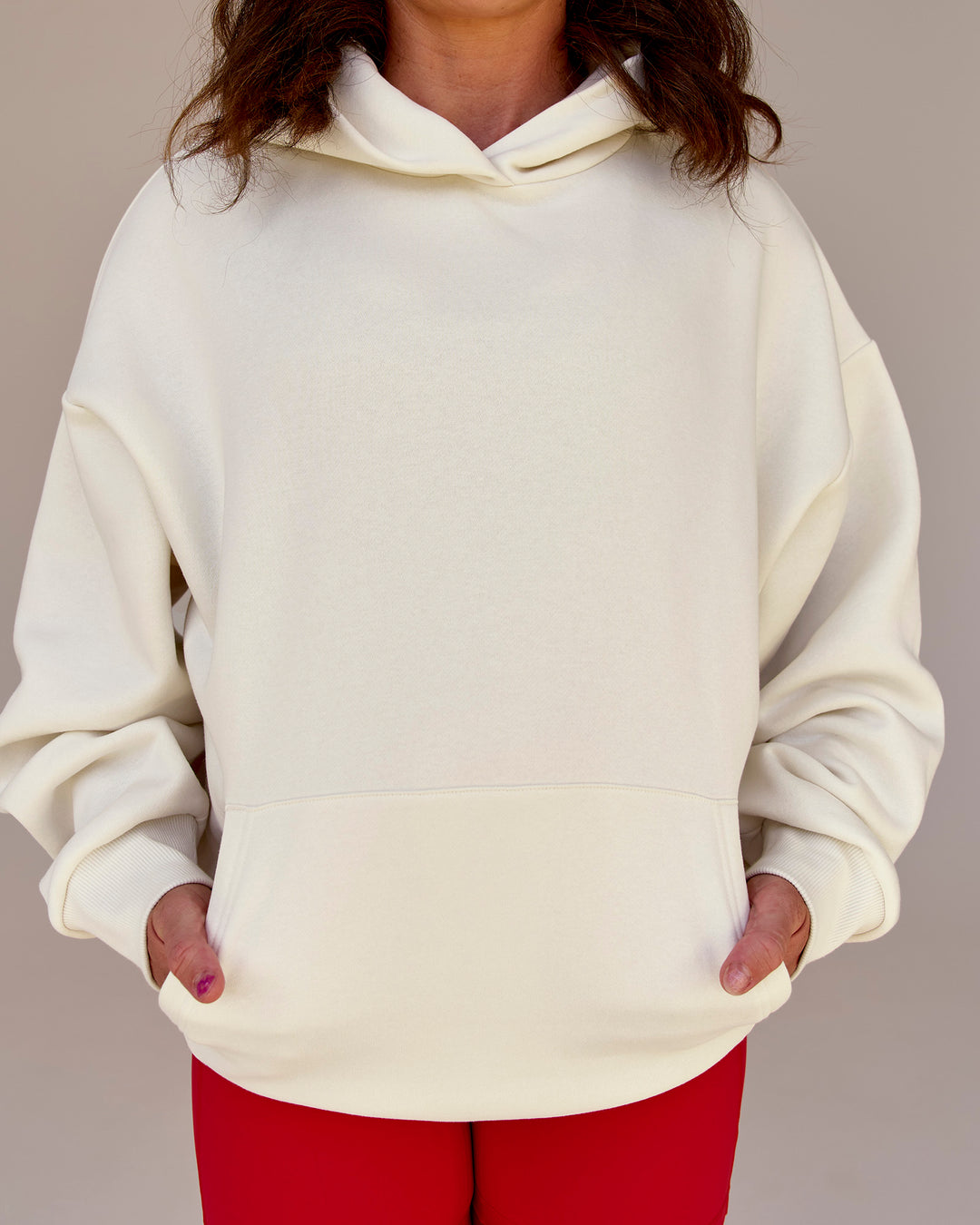 Woman wearing Greatest of All Time Heavyweight Oversized Hoodie - Off White | Model:Tia | Size:S - view 13