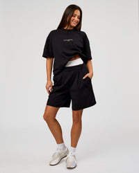 Woman wearing Andrew J. Steel x LSKD Heavyweight Boxed Tee - Black | Model:Bianca | Size:XS | Thumbnail Index: 6