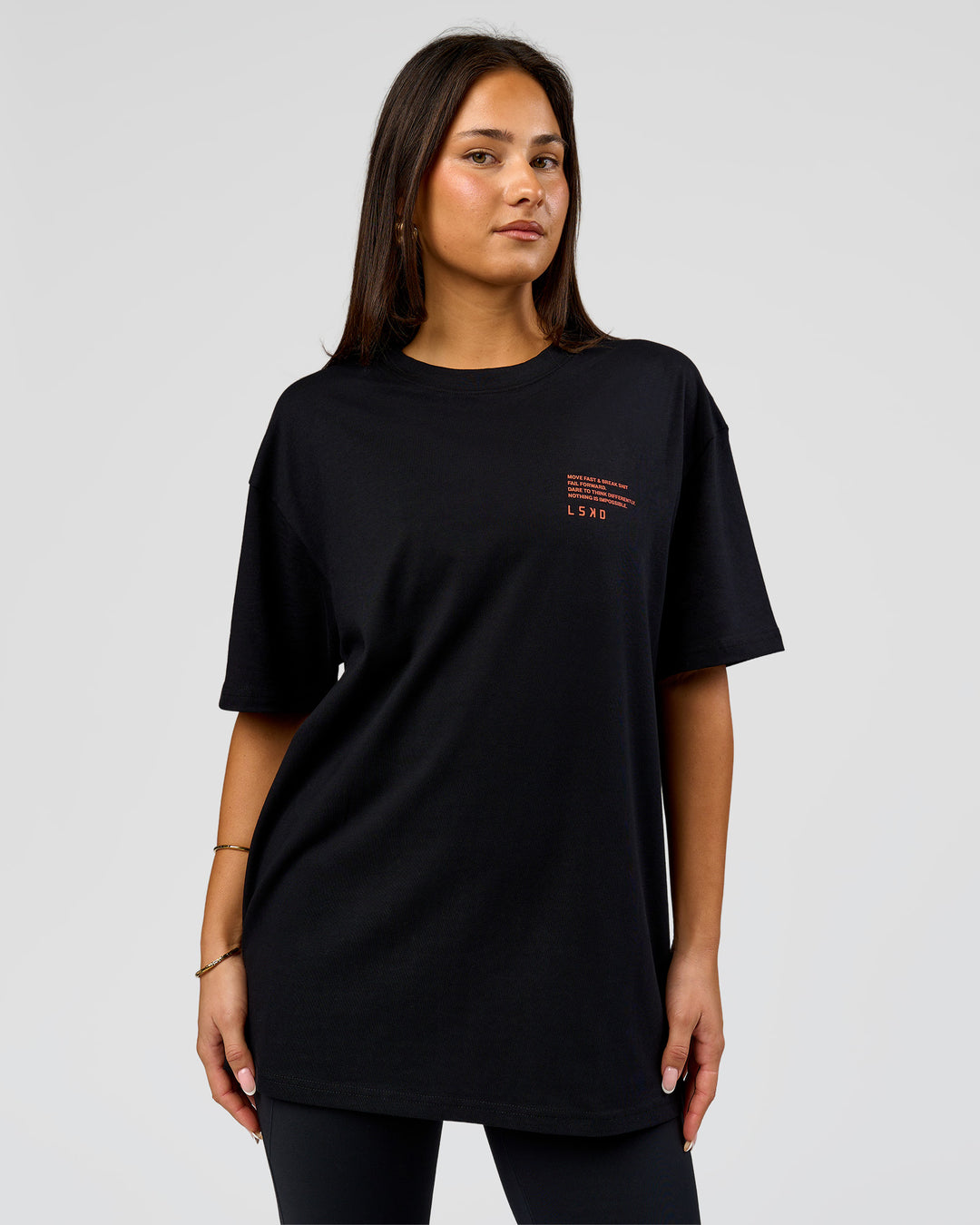 Woman wearing Coffee Run FLXCotton Oversized Tee - Black-Ultra Orange | Model:Bianca | Size:XS - view 4