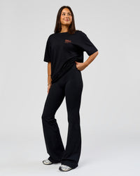 Woman wearing Coffee Run FLXCotton Oversized Tee - Black-Ultra Orange | Model:Bianca | Size:XS | Thumbnail Index: 6
