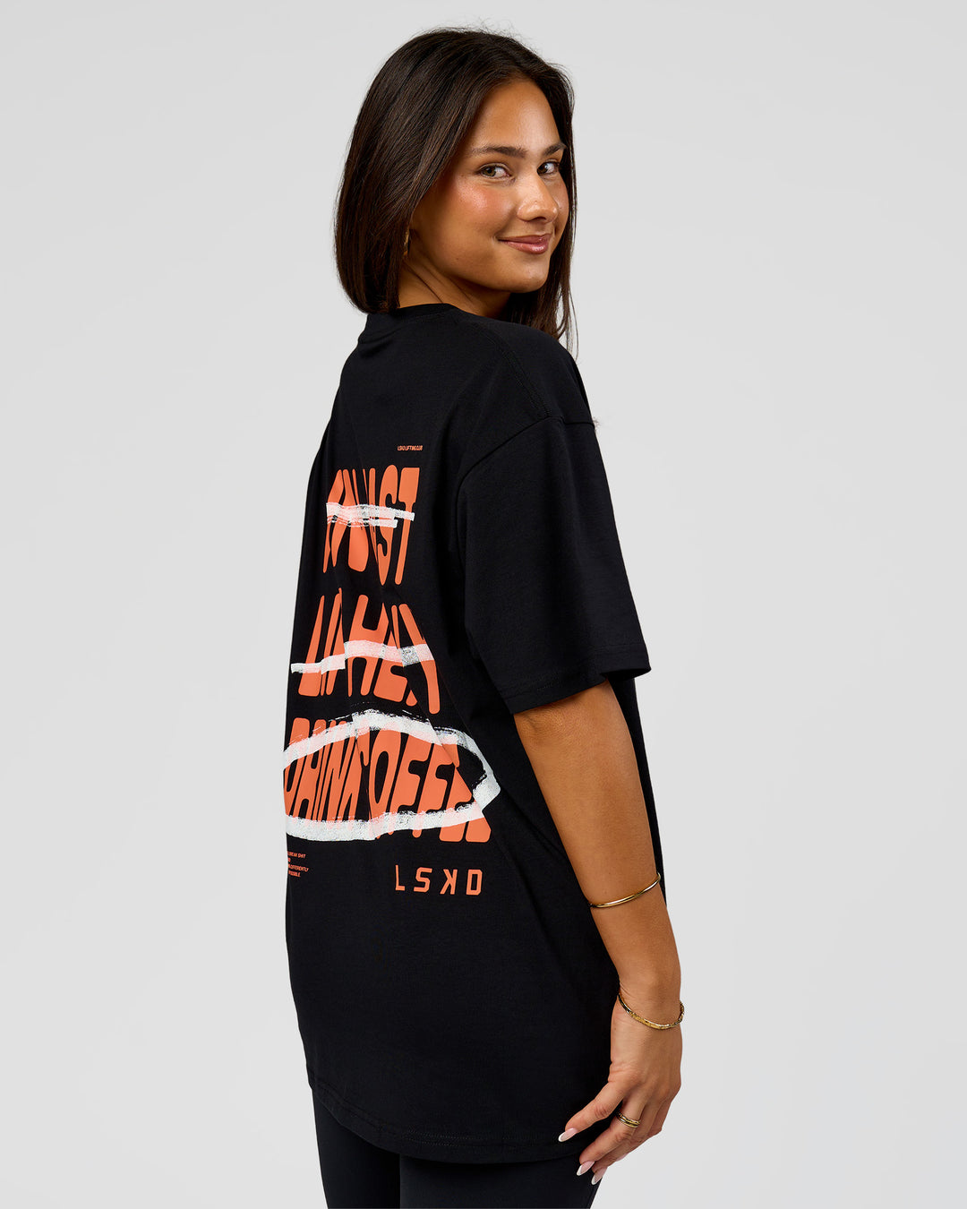 Woman wearing Coffee Run FLXCotton Oversized Tee - Black-Ultra Orange | Model:Bianca | Size:XS - view 14