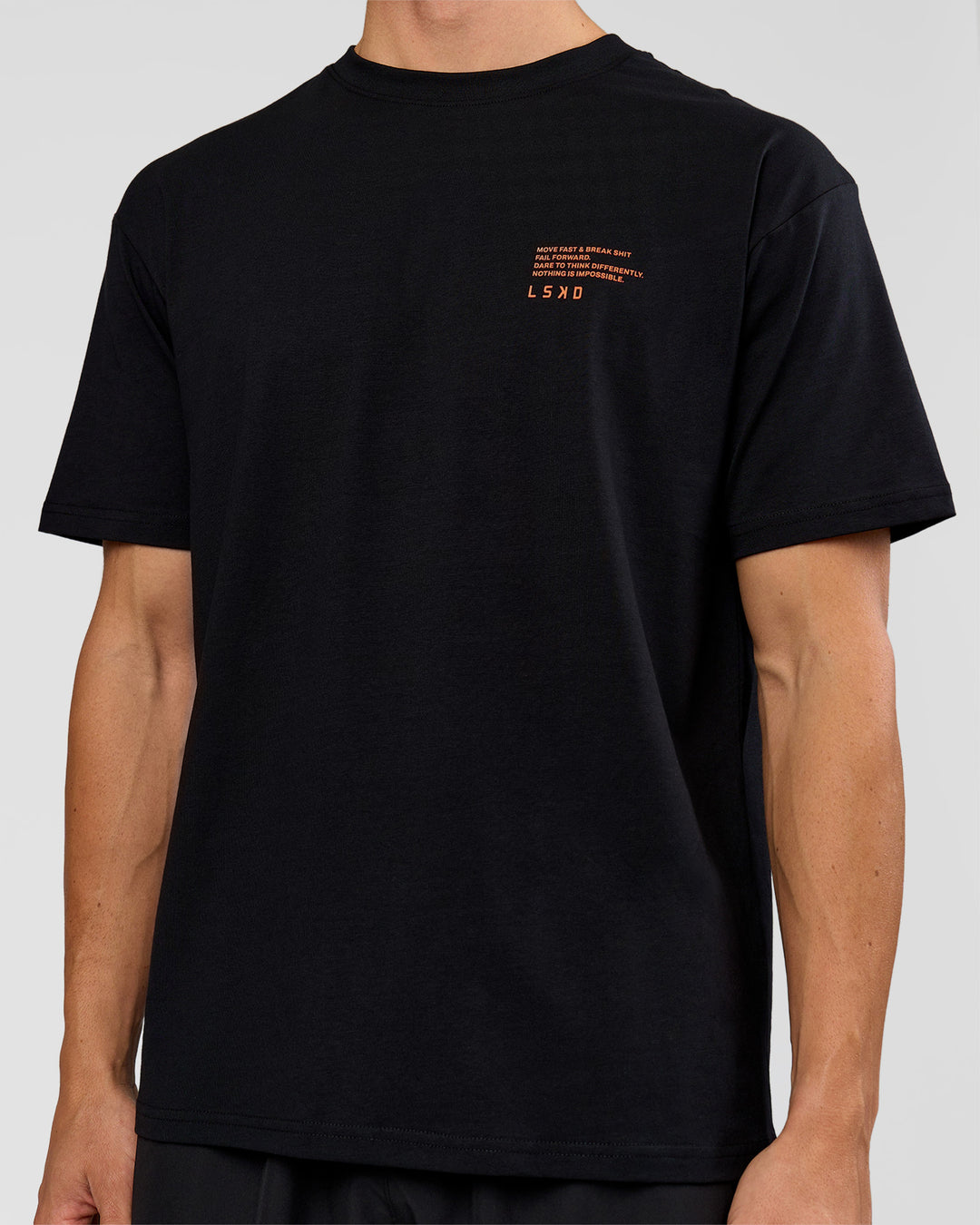 Woman wearing Coffee Run FLXCotton Oversized Tee - Black-Ultra Orange | Model:Bianca | Size:XS - view 16