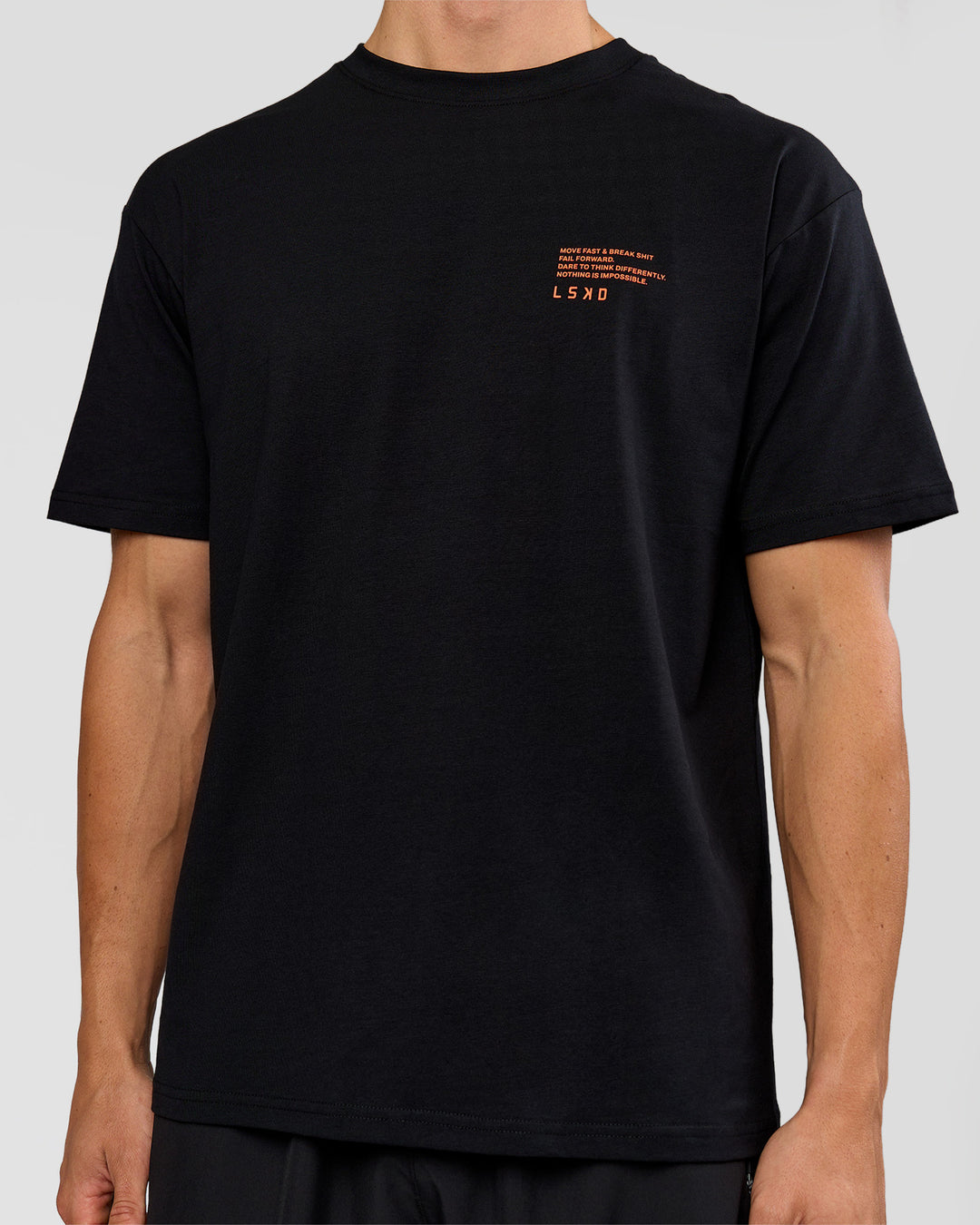 Woman wearing Coffee Run FLXCotton Oversized Tee - Black-Ultra Orange | Model:Bianca | Size:XS - view 18