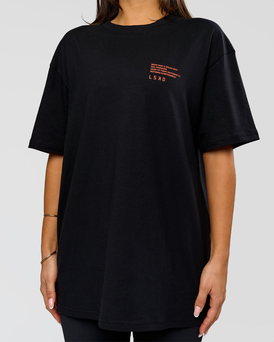 Woman wearing Coffee Run FLXCotton Oversized Tee - Black-Ultra Orange | Model:Bianca | Size:XS - view 22