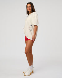 Woman wearing Greatest of All Time Heavyweight FLXCotton Oversized Tee - Off White Washed-Scarlet | Model:Bianca | Size:XS | Thumbnail Index: 8