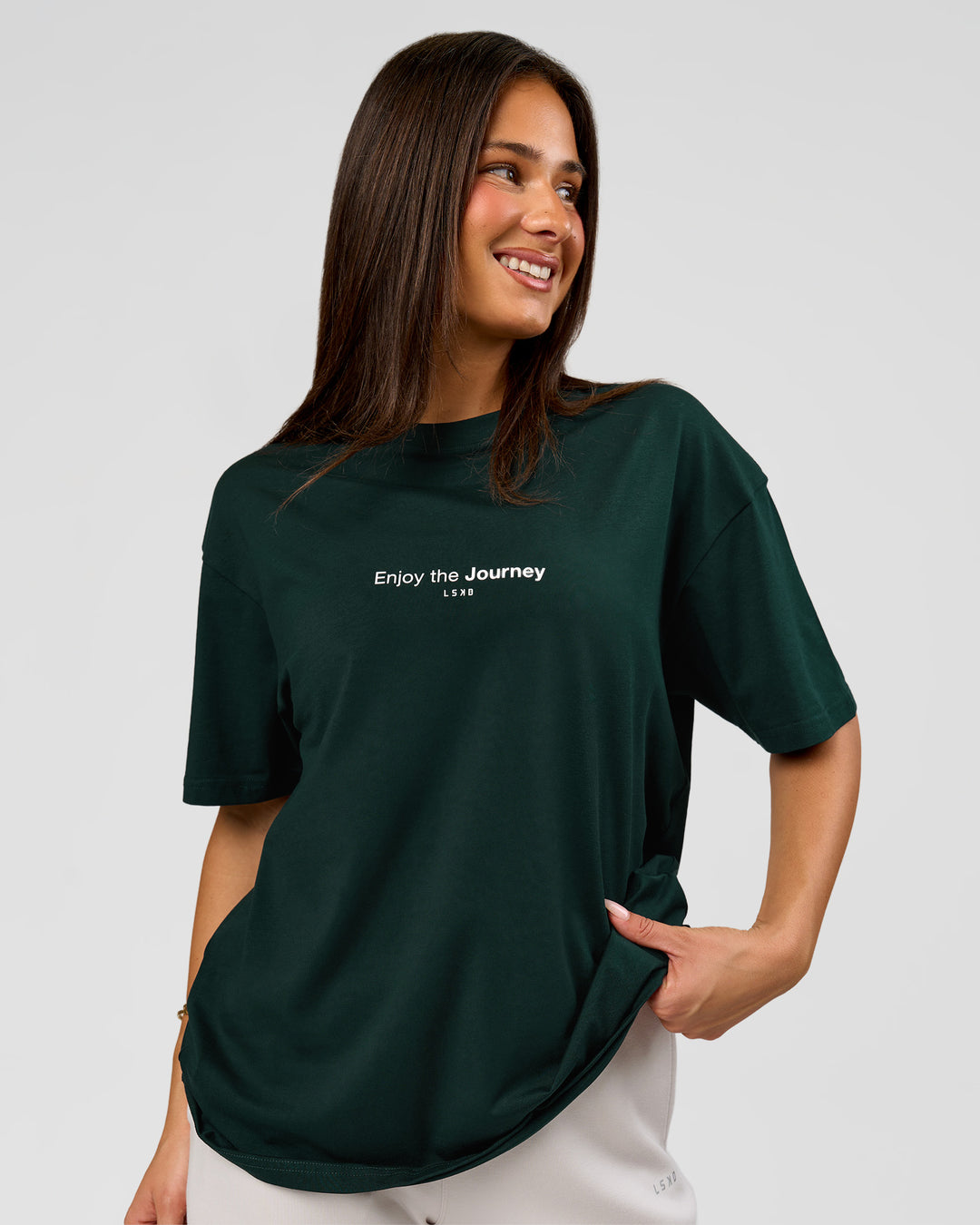 Woman wearing VS1 Enjoy The Journey FLXCotton Oversize Tee - Midnight Green | Model:Bianca | Size:XS - view 3