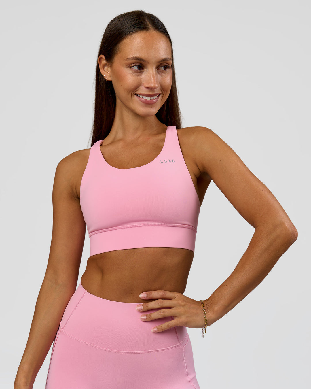 Woman wearing Accelerate Sports Bra - Pink Rose | Model:Brylee | Size:XS