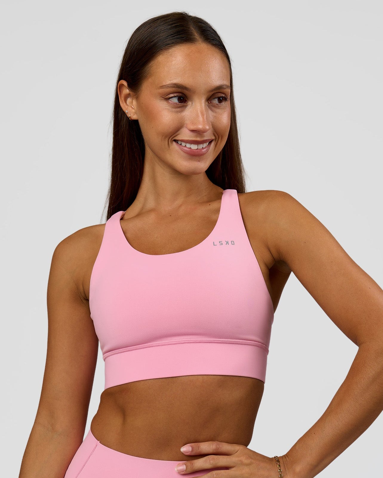 Woman wearing Accelerate Sports Bra - Pink Rose | Model:Brylee | Size:XS