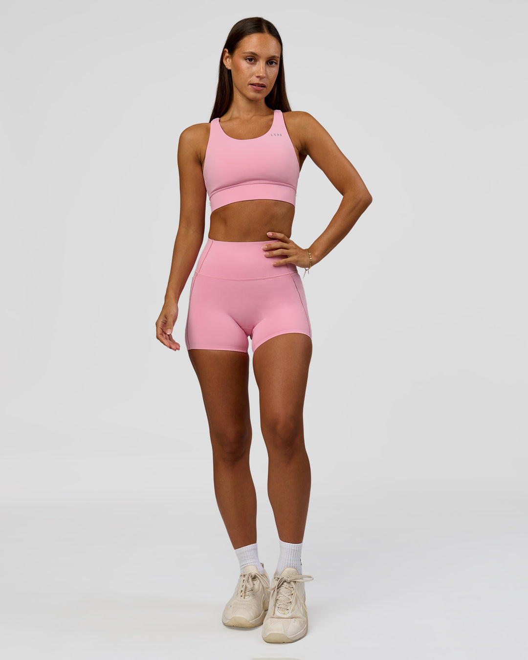 Woman wearing Accelerate Sports Bra - Pink Rose | Model:Brylee | Size:XS