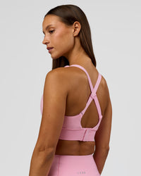 Woman wearing Accelerate Sports Bra - Pink Rose | Model:Brylee | Size:XS