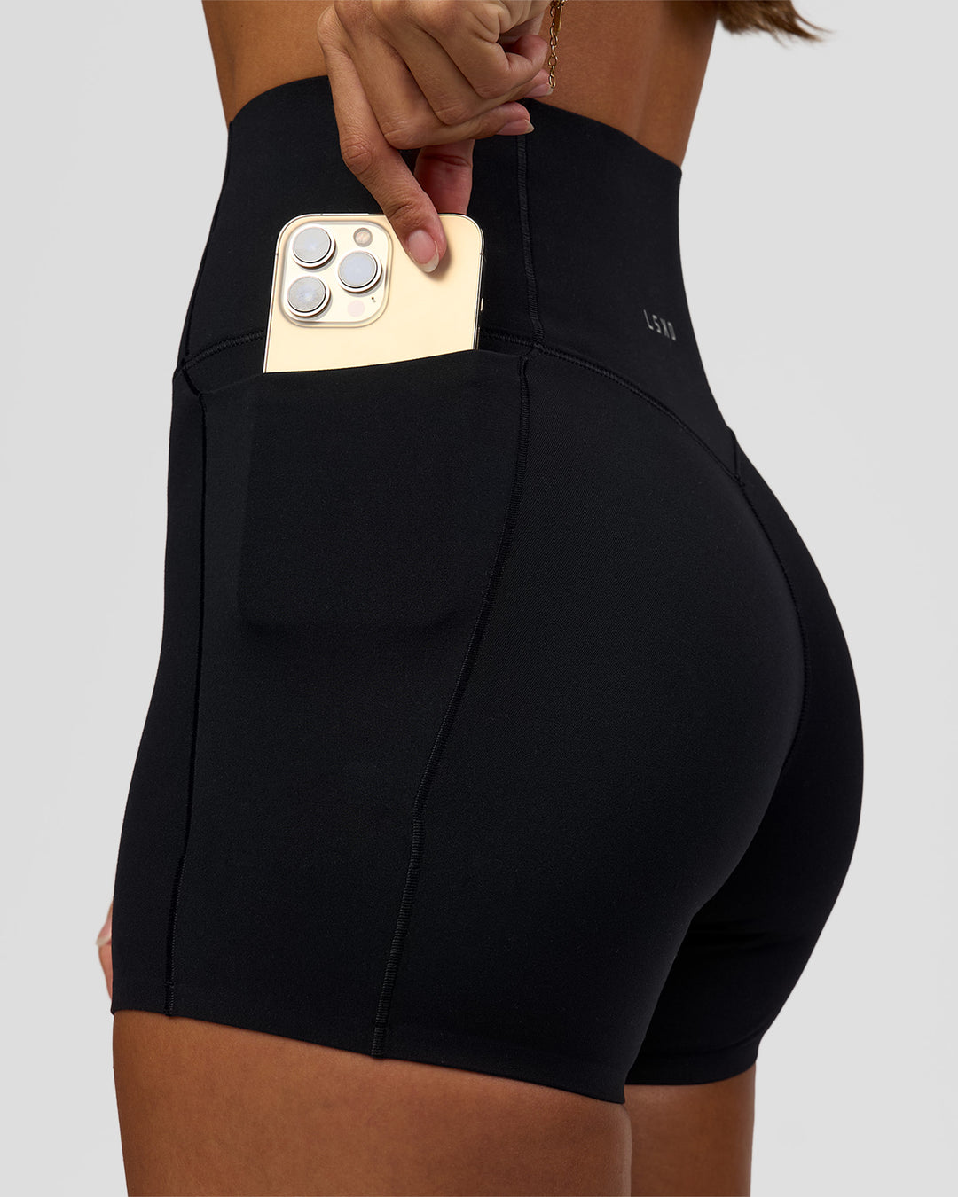 Woman wearing Fusion Bonded High-Rise 4" Short Pockets - Black | Model:Brylee | Size:XS - view 2