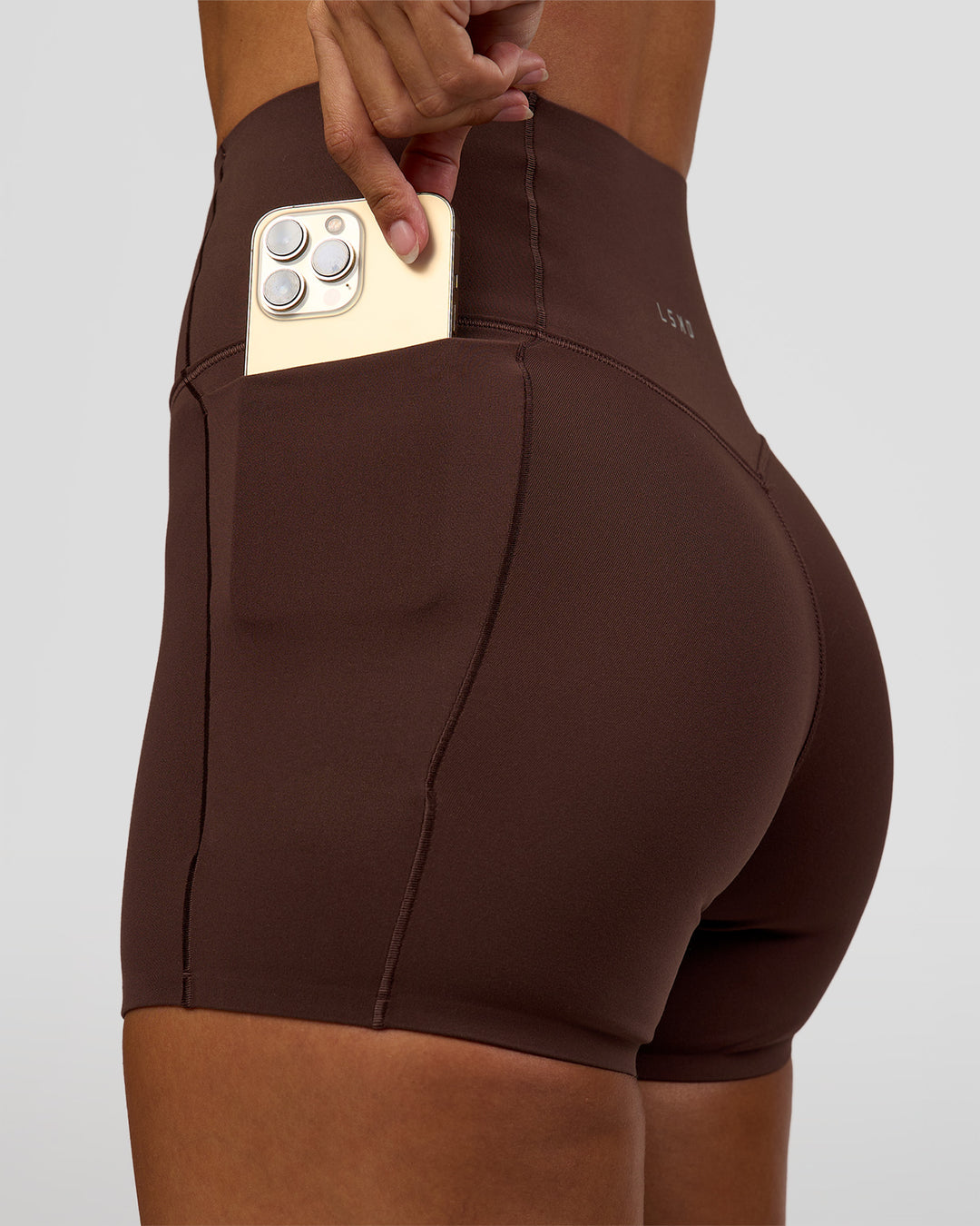 Woman wearing Fusion Bonded High-Rise 4" Short Pockets - Hot Chocolate | Model:Brylee | Size:XS - view 7