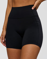 Woman wearing Fusion Bonded High-Rise 6" Short Pockets - Black | Model:Brylee | Size:XS | Thumbnail Index: 0