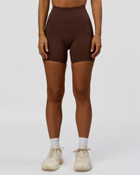 Woman wearing Fusion Bonded High-Rise 6" Short Pockets - Hot Chocolate | Model:Brylee | Size:XS | Thumbnail Index: 1