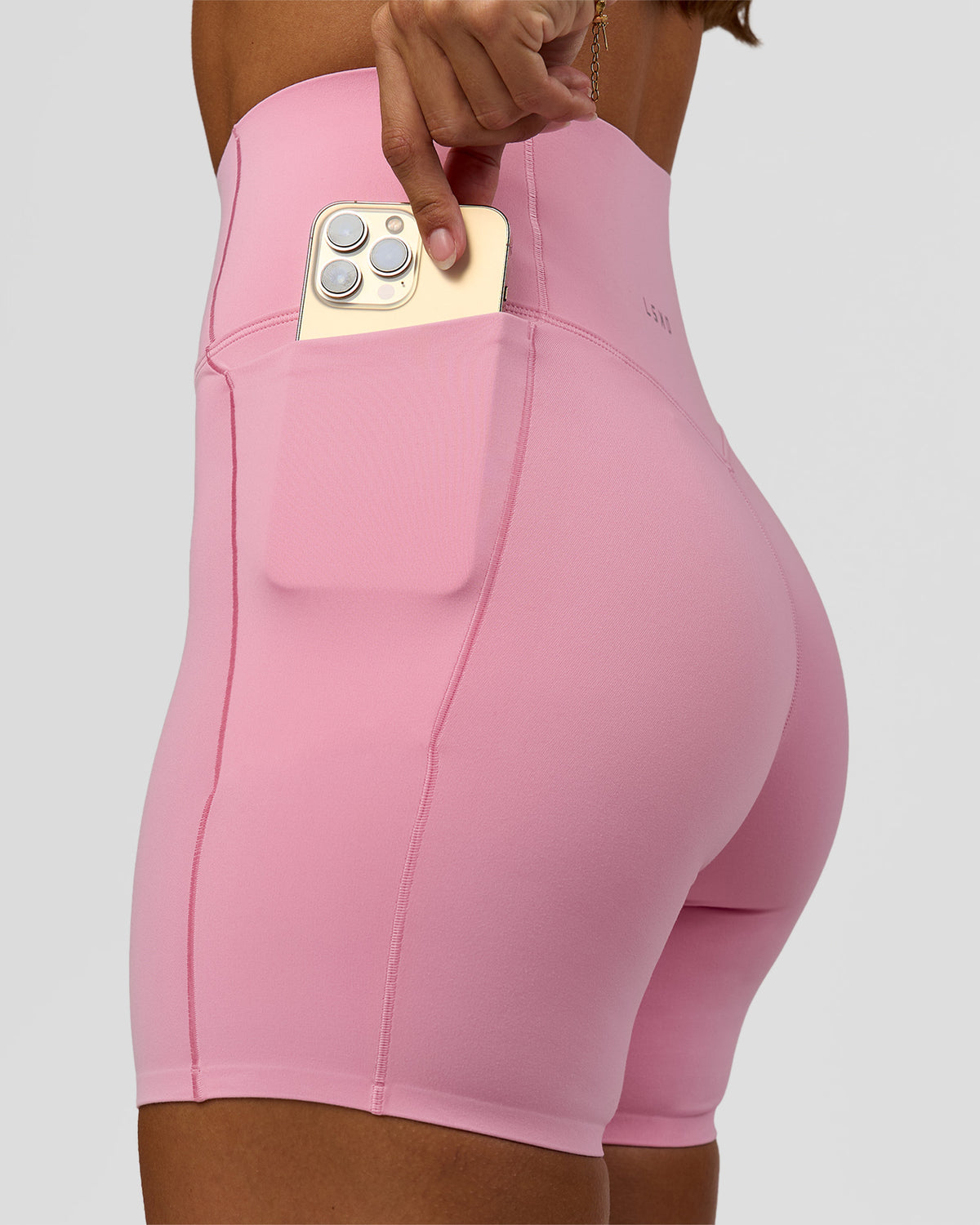 Woman wearing Fusion Bonded High-Rise 6" Short Pockets - Pink Rose | Model:Brylee | Size:XS