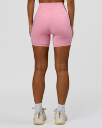 Woman wearing Fusion Bonded High-Rise 6" Short Pockets - Pink Rose | Model:Brylee | Size:XS | Thumbnail Index: 3