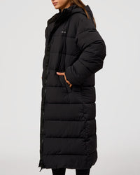 Woman wearing Go-To Puffer Long Jacket - Black | Model:Brylee | Size:XS