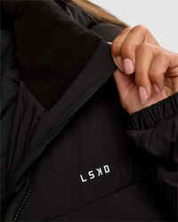 Woman wearing Go-To Puffer Long Jacket - Black | Model:Brylee | Size:XS