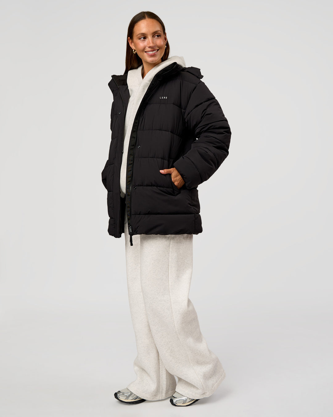 Woman wearing Go-To Puffer Mid Jacket - Black | Model:Brylee | Size:XS