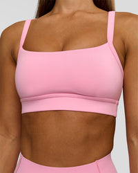 Woman wearing Momentum Sports Bra - Pink Rose | Model:Brylee | Size:XS | Thumbnail Index: 1