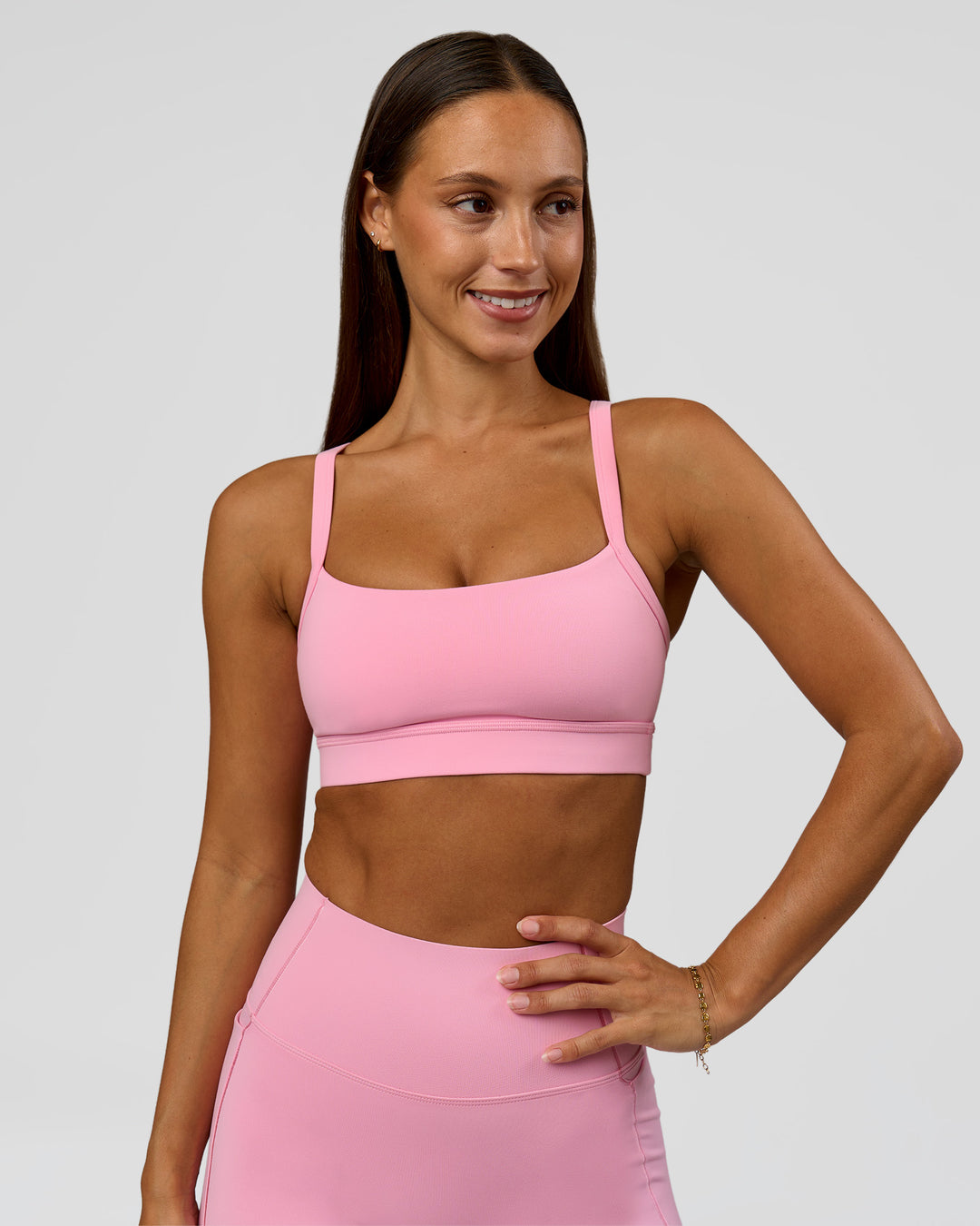 Woman wearing Momentum Sports Bra - Pink Rose | Model:Brylee | Size:XS - view 1