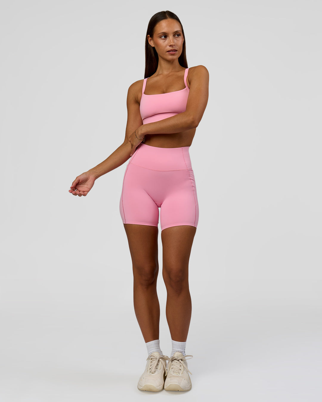 Woman wearing Momentum Sports Bra - Pink Rose | Model:Brylee | Size:XS - view 5