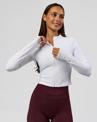 Woman wearing Sculpt Full Zip Long Sleeve Top - White | Model:Brylee | Size:XS | Thumbnail Index: 2