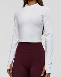 Woman wearing Sculpt Full Zip Long Sleeve Top - White | Model:Brylee | Size:XS | Thumbnail Index: 4