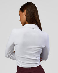 Woman wearing Sculpt Full Zip Long Sleeve Top - White | Model:Brylee | Size:XS | Thumbnail Index: 7
