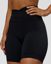 Woman wearing Solstice High-Rise 6" Short - Black | Model:Brylee | Size:XS | Thumbnail Index: 0
