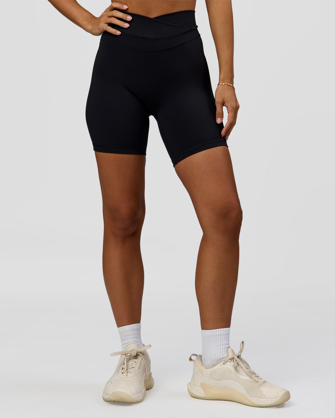 Woman wearing Solstice High-Rise 6" Short - Black | Model:Brylee | Size:XS - view 2