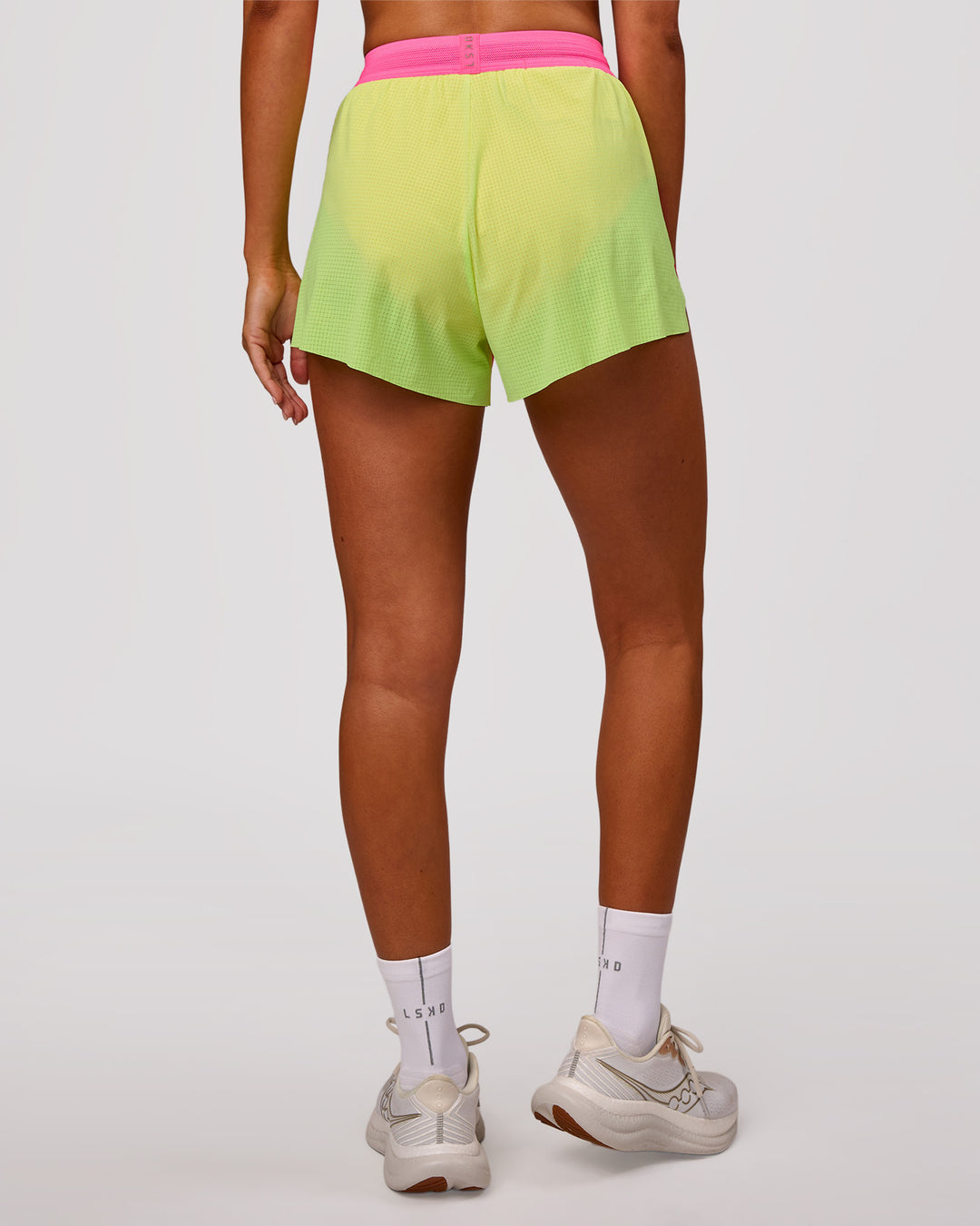 Woman wearing Accelerate 3" High-Rise Running Short - Lime Glo-Sugar Plum | Model:Charli | Size:XS - view 3