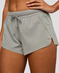 Woman wearing Accelerate 3" Mid-Rise Running Short - Alloy | Model:Charli | Size:XS | Thumbnail Index: 2