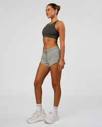 Woman wearing Accelerate 3" Mid-Rise Running Short - Alloy | Model:Charli | Size:XS | Thumbnail Index: 6