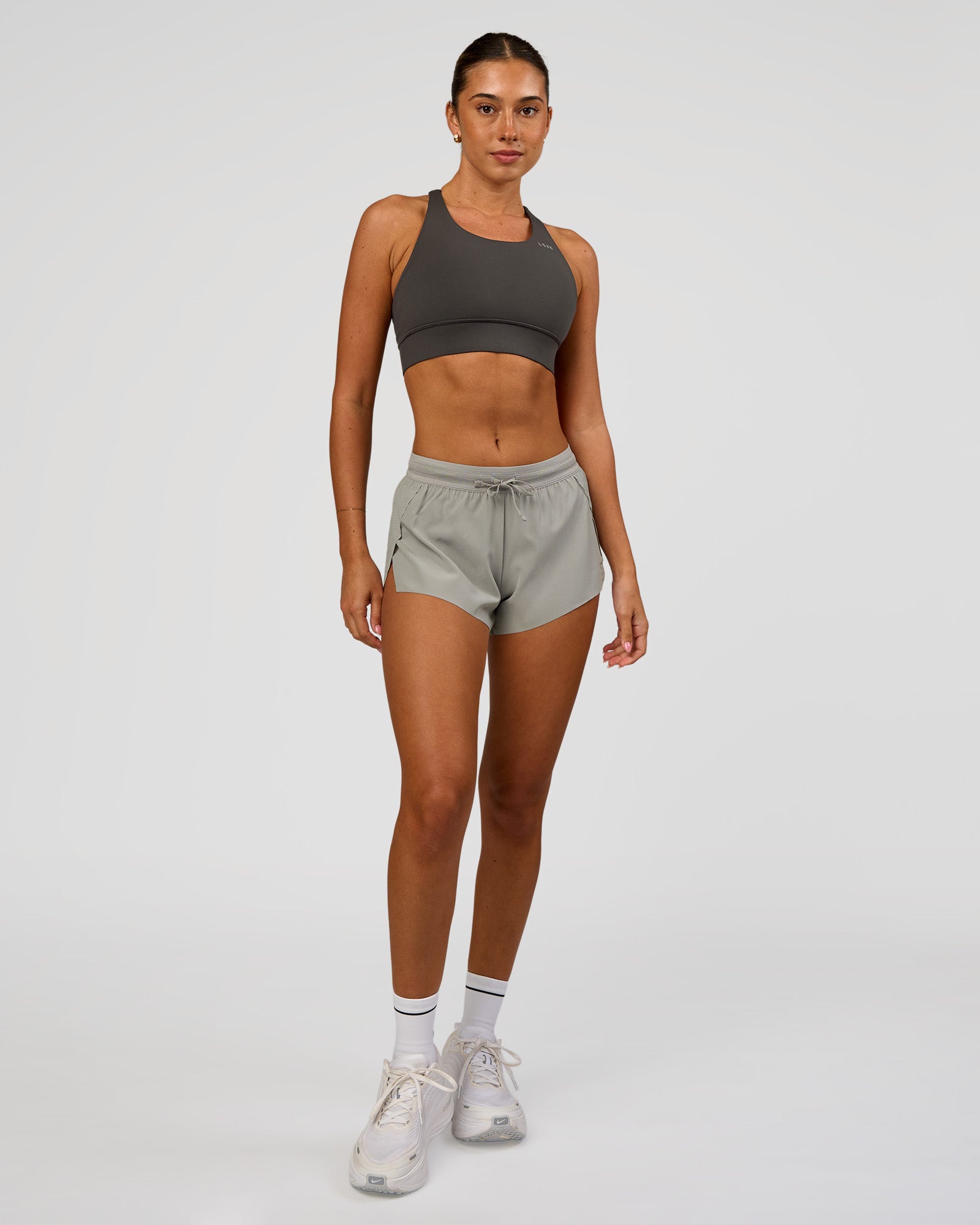 Woman wearing Accelerate 3" Mid-Rise Running Short - Alloy | Model:Charli | Size:XS