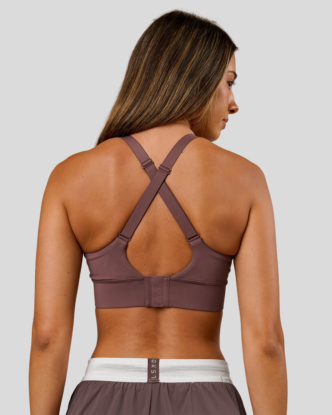 Woman wearing Accelerate Sports Bra - Cocoa Powder | Model:Charli | Size:XS - view 3